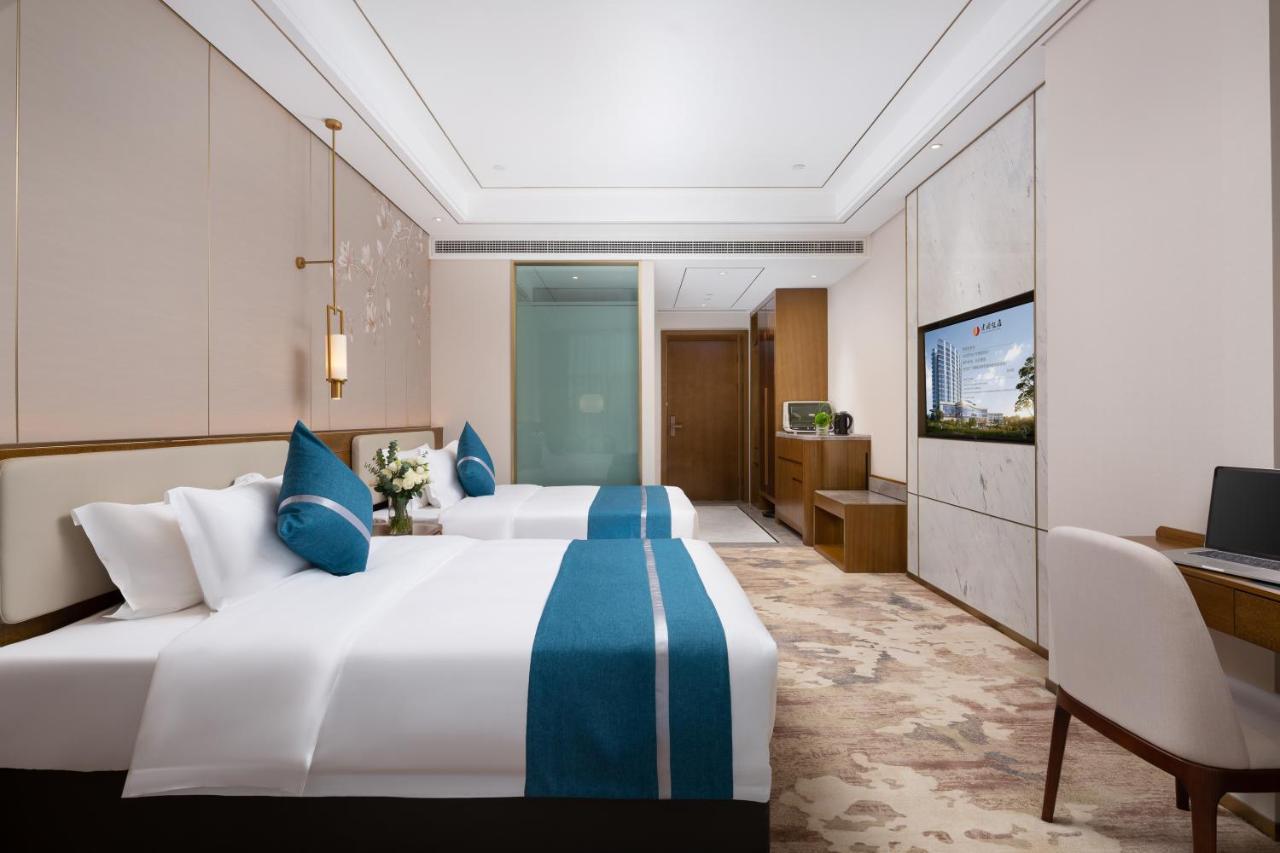 Luzhou Jianguo Hotel Bagian luar foto